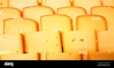 Swiss cheese slices close-up. Typical swiss cheese Stock Photo - Alamy