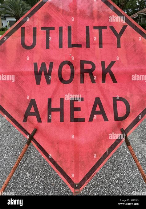 Red utility work ahead sign Stock Photo - Alamy