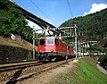 A train passing two spiral tunnels near Giornico