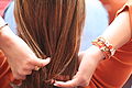 Woman wearing UT jewelry at a football game