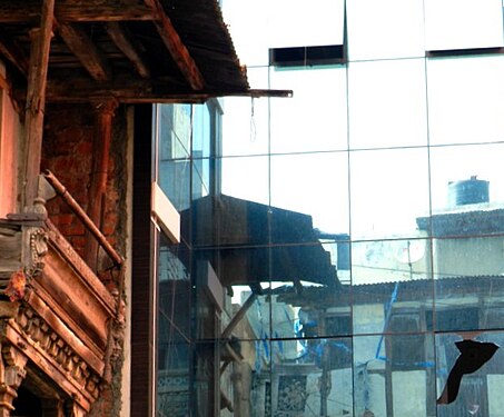 Tin roof reflecting on glass building at Vadodara