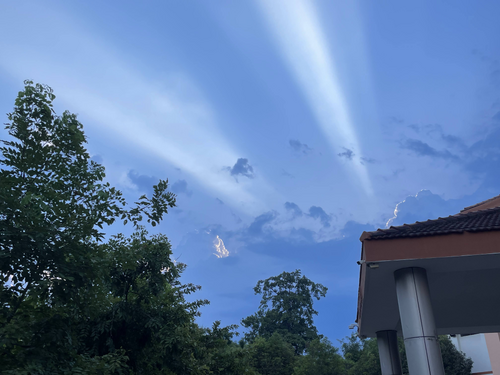 Beams of sunlight shoot through the clouds right above a student cafeteria hall in Chennai, India.