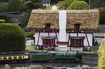 Thatched pub and train