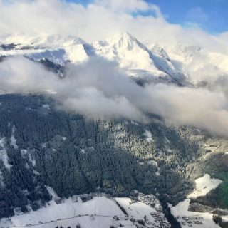 plane-window-view-taking-off-innsbruck-airport-photo