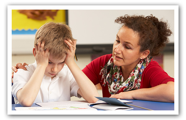 female teacher siting with frustrated boy