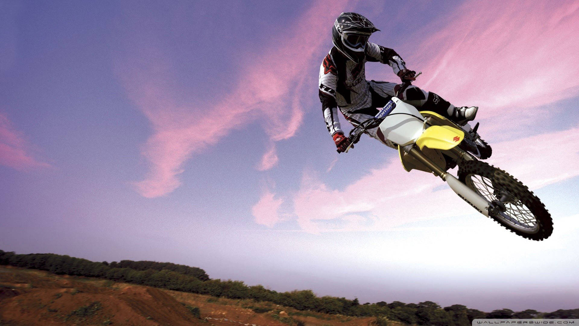 Breathtaking Mid-air Moment on a Dirt Bike Wallpaper