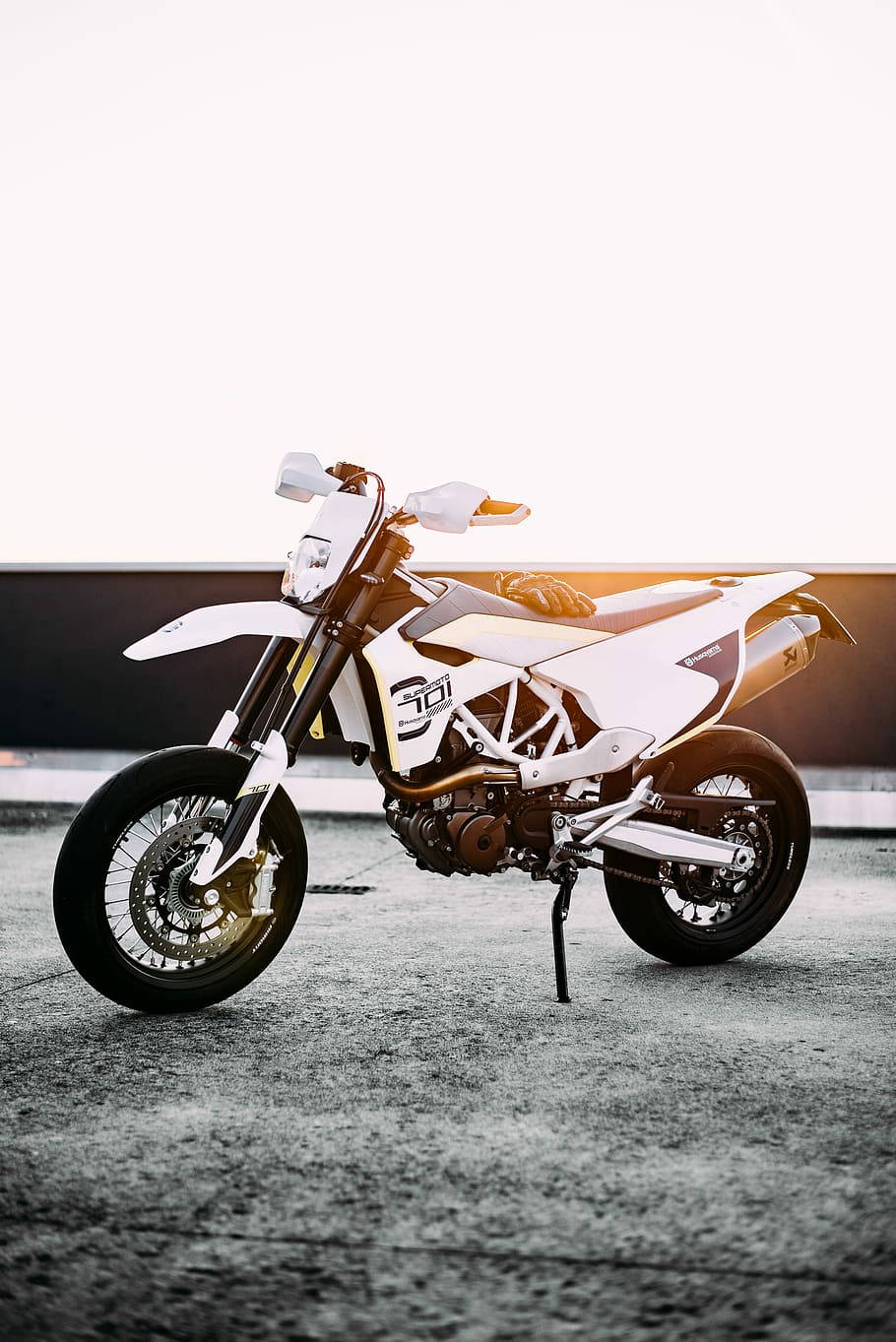 Thrilling Adventure with White Dirt Bike Wallpaper