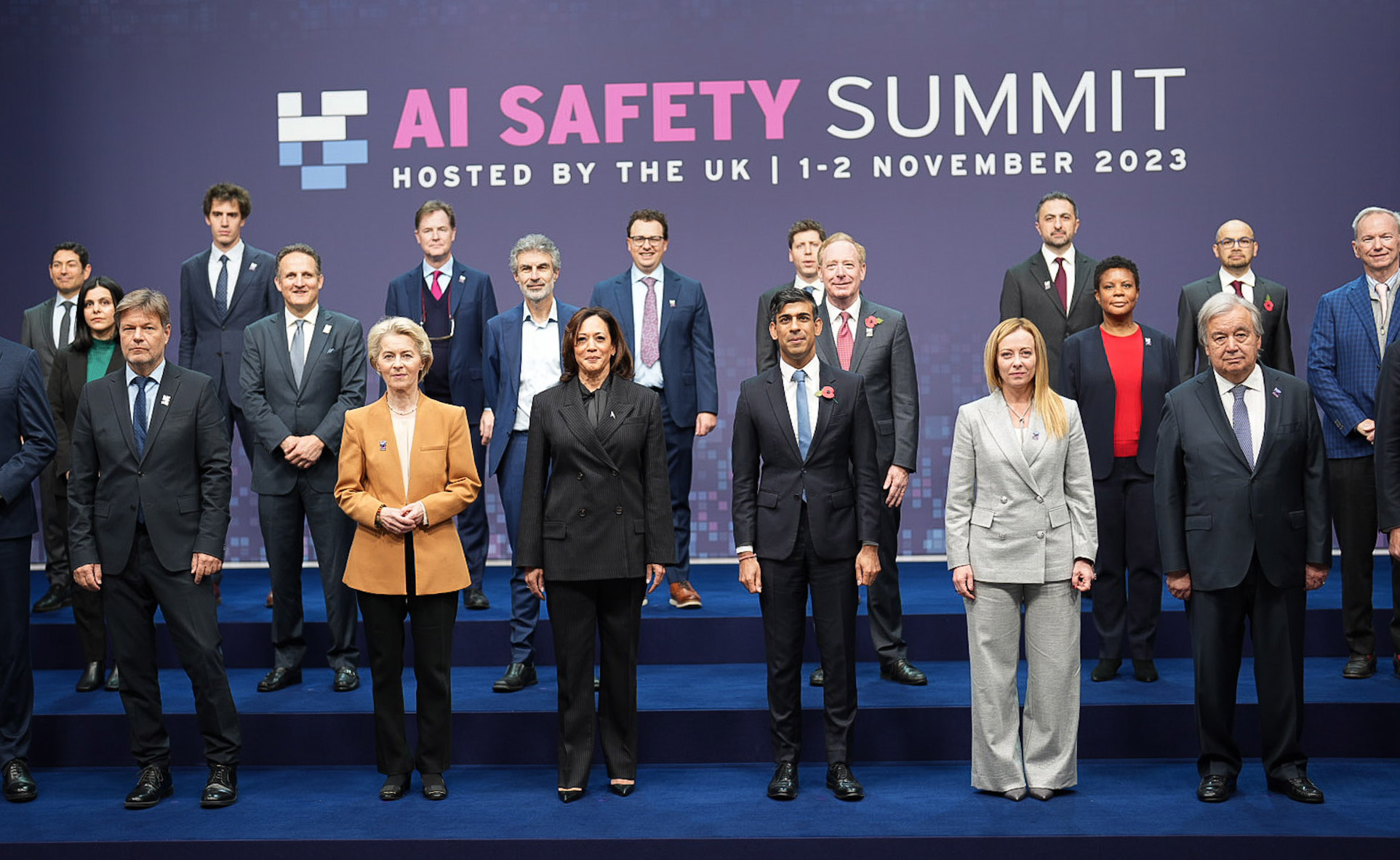 group photo of Kamala Harris and world leaders standing with technology leaders in the field of AI, including Sam Altman, Arthur Mensch, Eric Schmidt et al