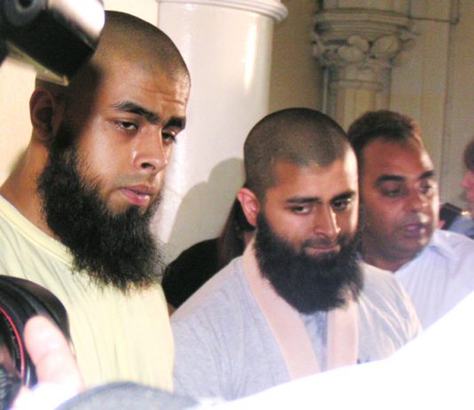 The two brothers ABUL KOYAIR and MOHAMMED ABDUL KAHAR, who suffered throughout the press conference from the effect of his injuries