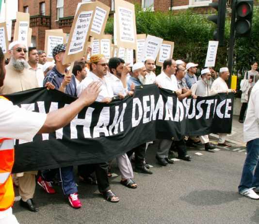 The front of the 4,000-strong demonstration against the police raid in Forest Gate making its way through Newham yesterday