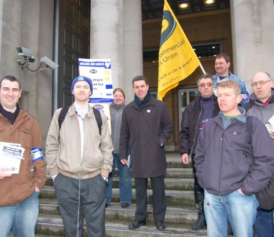 Mark Serwotka, PCS leader (centre), with a group outside the Ministry of Defence yesterday morning