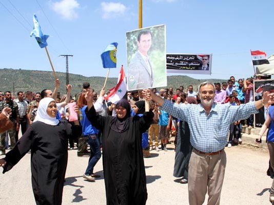 Syrians enthusiastically show their support for President Assad in Lattakia in the run-up to the election on June 4th