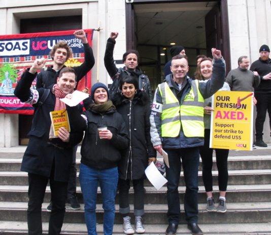 Picket at the School of Oriental and African Studies (above right) in central London show their determination to defend their pensions