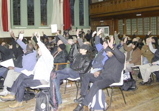 A section of the Council of Action Conference voting on the resolution