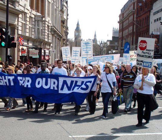 Health workers march through the centre of London to defend the National Health Service