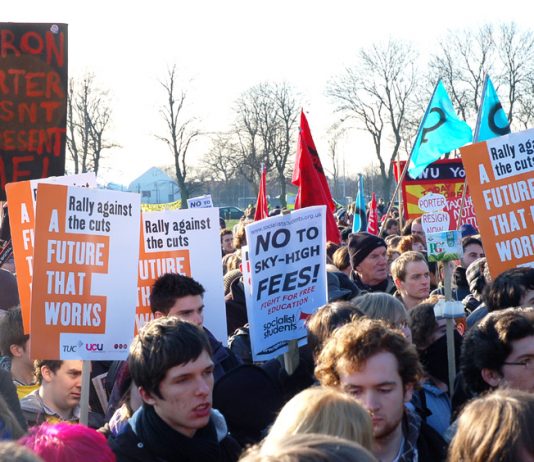 Students and workers rally in Manchester against tuition fees and cuts – a placard reads: ‘’Aaron Porter doesn’t represent me’