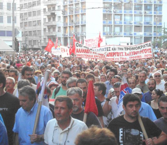 Greek workers on the march in Athens in support of striking steelworkers who have repeatedly been attacked by baton-wielding riot police