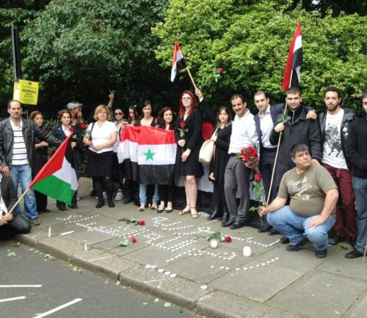 Syrians hold a vigil outside their embassy in London last Thursday to commemorate the Syrian government leaders who died in that day’s terrorist bombing in Damascus