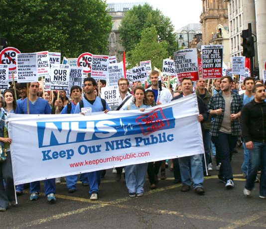 Hospital workers marching last May against the sell-off of NHS services