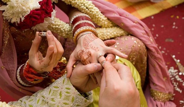 Punjabi Indian Bride And Groom Holding Hands