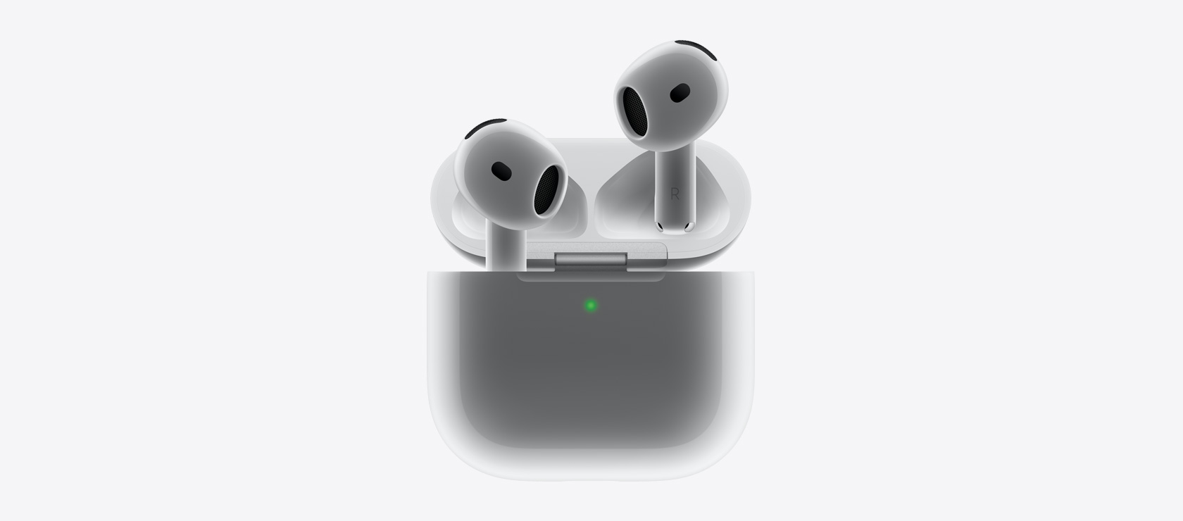 Un paio di AirPods 4 mentre vengono inseriti nella custodia di ricarica.