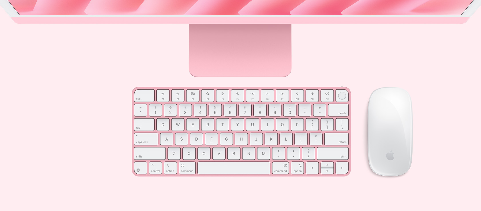 Overhead view of pink iMac with color-matching mouse and keyboard