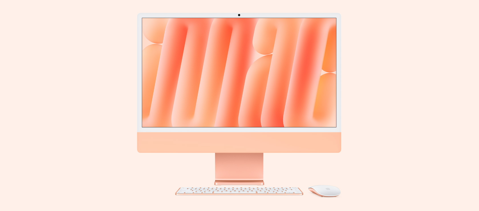 Front view of orange iMac with color-matching mouse and keyboard