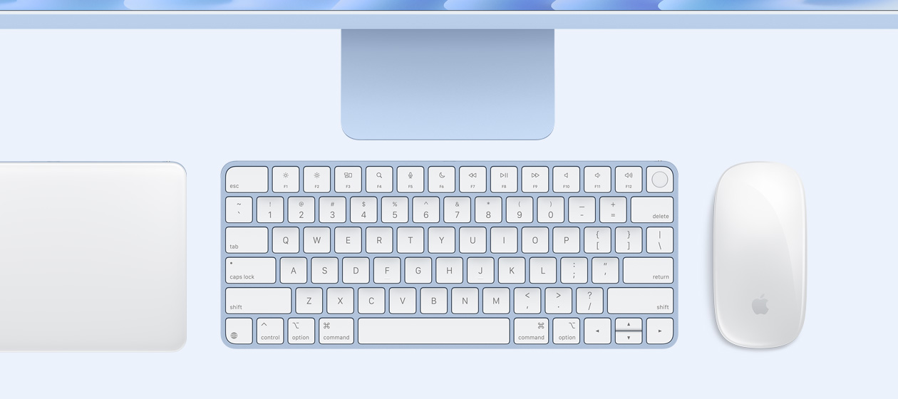 Overhead view of iMac with Magic Trackpad, keyboard, and mouse