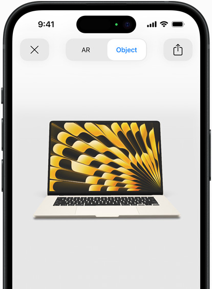 Preview of MacBook Air in Starlight colour being viewed in AR experience on iPhone