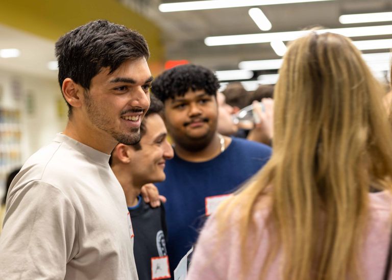 Students networking and smiling