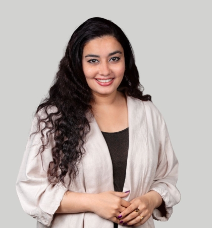 Headshot of woman on gray background