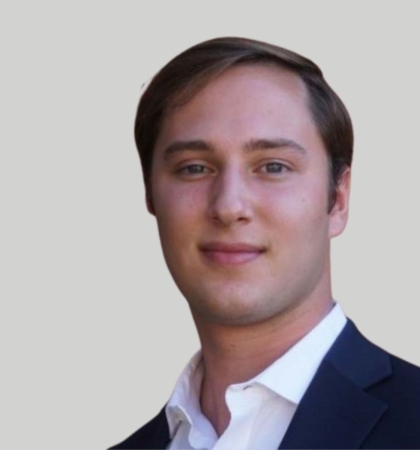 Headshot of man on grey background