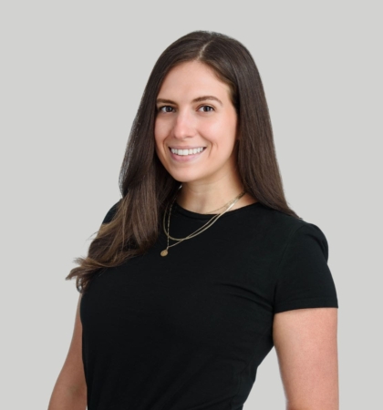 headshot of woman on gray background