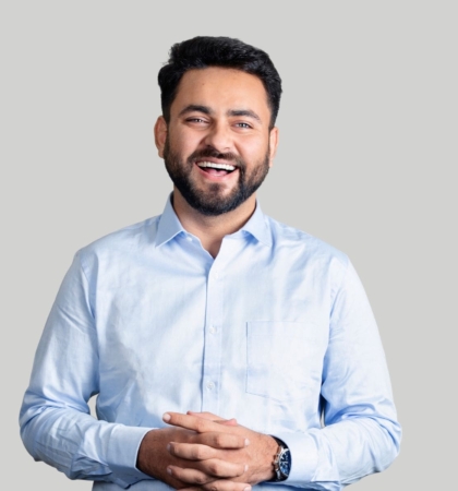 headshot of man on gray background