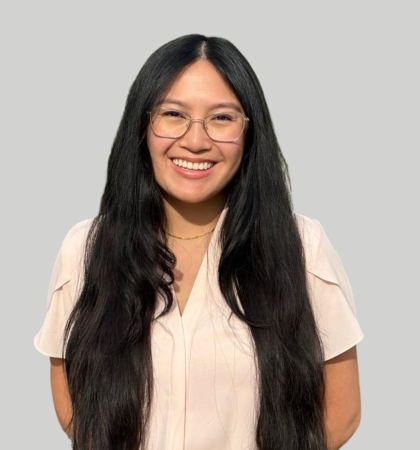 Headshot of woman on gray background