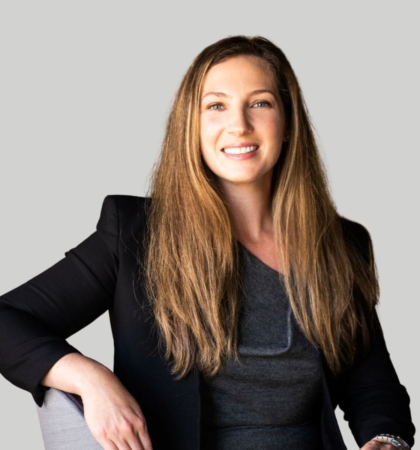 headshot of woman on gray background