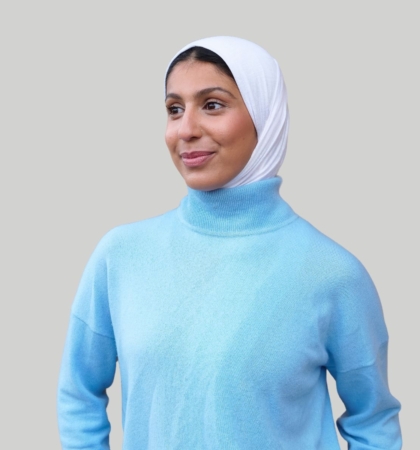 headshot of woman on gray background