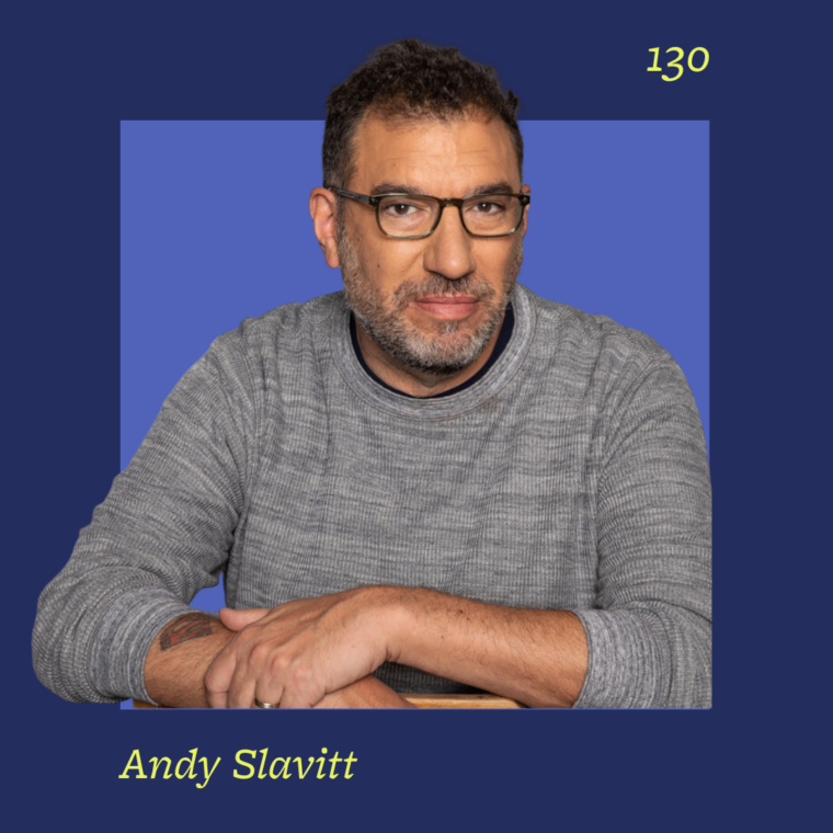 headshot of man on blue background