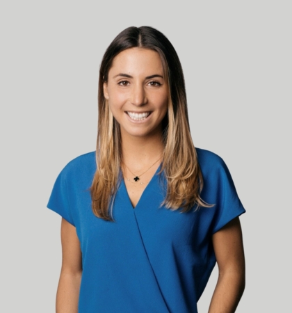 headshot of Emily Cahill on grey background