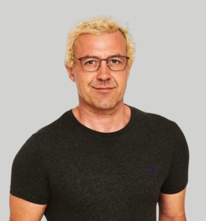 Headshot of man on gray background