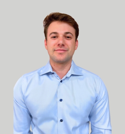 Headshot of man on grey background