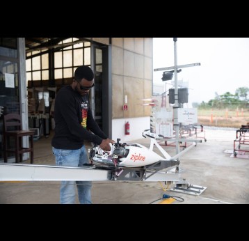 A flight operator at Zipline in Ghana packs a drone with medical supplies for delivery. Zipline delivers medical products using drones. Credit: Gavi/2022/Nipah Dennis