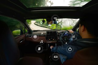 cockpit view of a car driving through forest roads