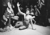 American actor Paul Robeson in the Berlin production of The Emperor Jones in 1930. He sits on the floor of a slave ship, surrounded by enslaved people.