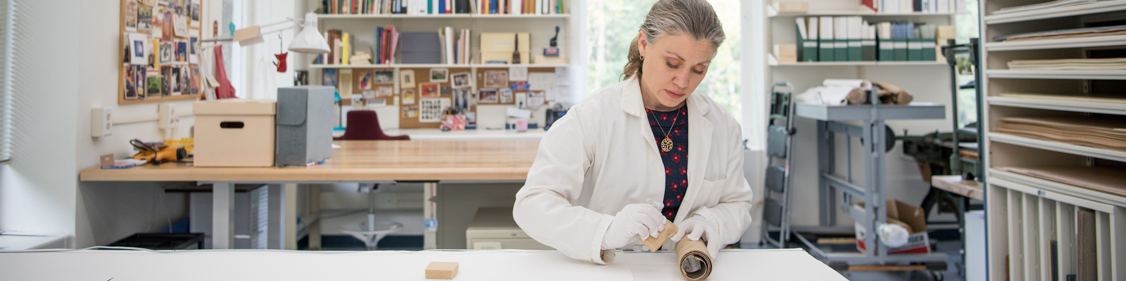 A library conservator works on a project in the conservation lab.