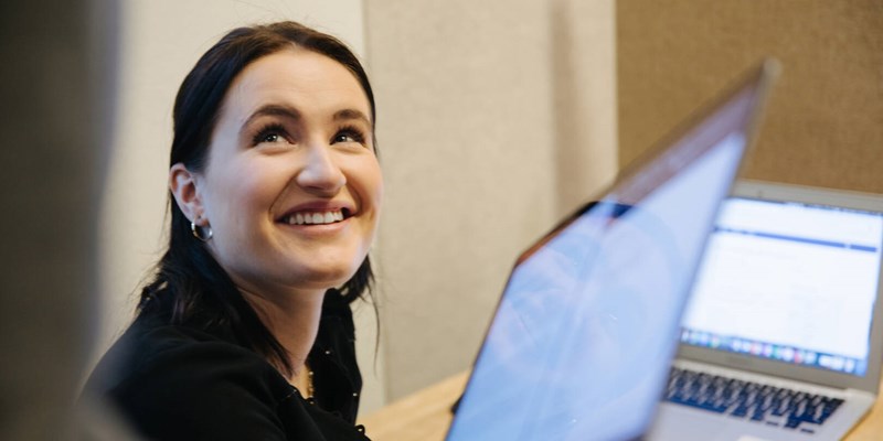 student smiling into the camera