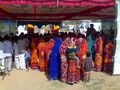 Jat women in tradional dress performing bhāt ceremony