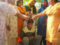 The ceremony of 'Haldi Rasm' on the marriage ceremony at bridegroom's house