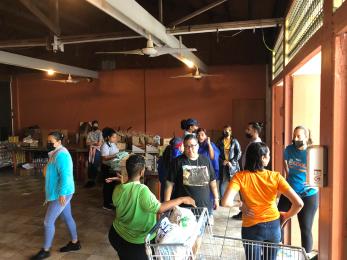 In cataño, puerto rico, volunteers at association pro juventud y comunidad de barrio palmas, a mercy corps resilience hub, prepare supplies for distribution. 