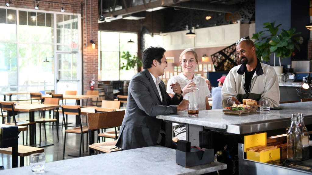 NC State alumni enjoy a drink and each others company at a local restaurant.